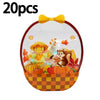 A set of 20 Halloween pumpkin witch treat bags in an orange and yellow checkered basket with a yellow bow.