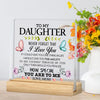 A clear acrylic desk sign with a handwritten message to daughter featuring butterflies and floral accents.