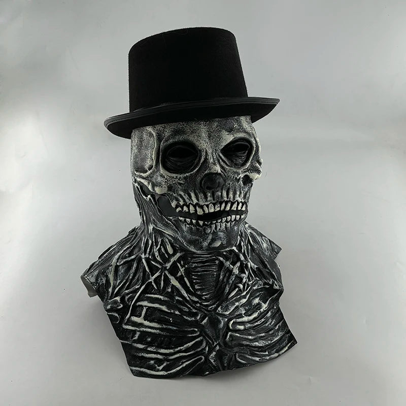 A realistic latex skull mask with a top hat and skeletal features, displayed against a light background.