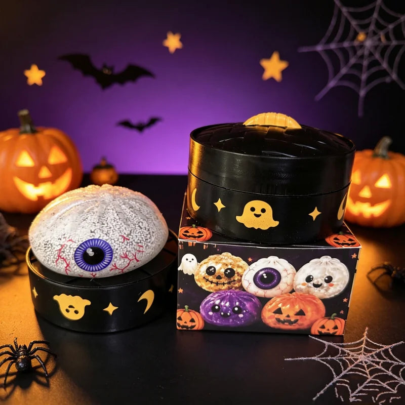A black sensory squishy blind box stress relief toy with a yellow lid and Halloween-themed decorations on a dark surface.