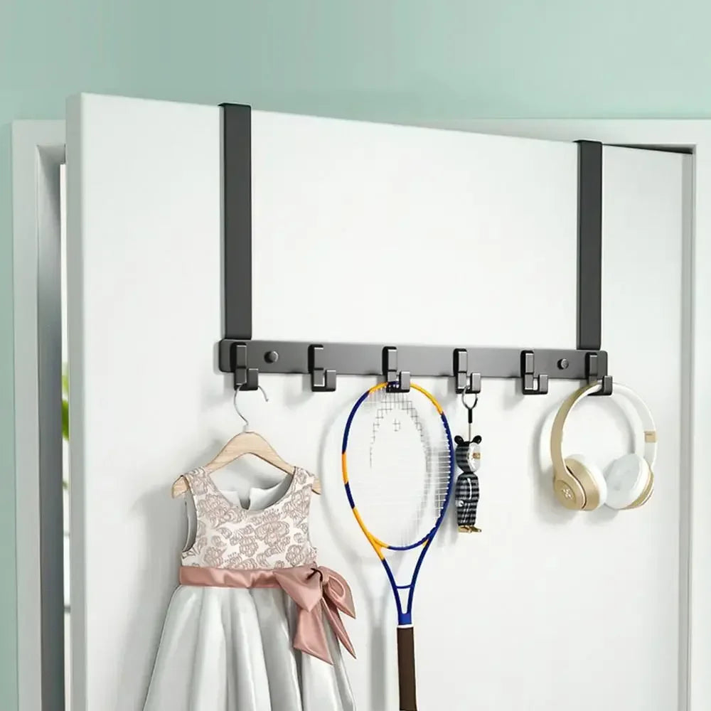 Heavy duty aluminum door hooks with six capacity hanging on a white door frame.