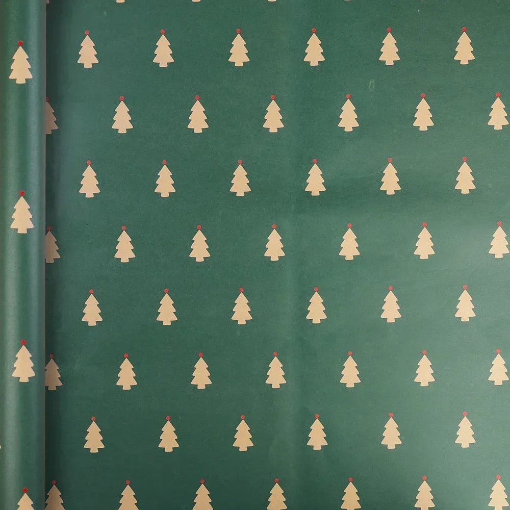 A roll of festive Christmas kraft wrapping paper featuring repeating small green pine trees on a muted green background.