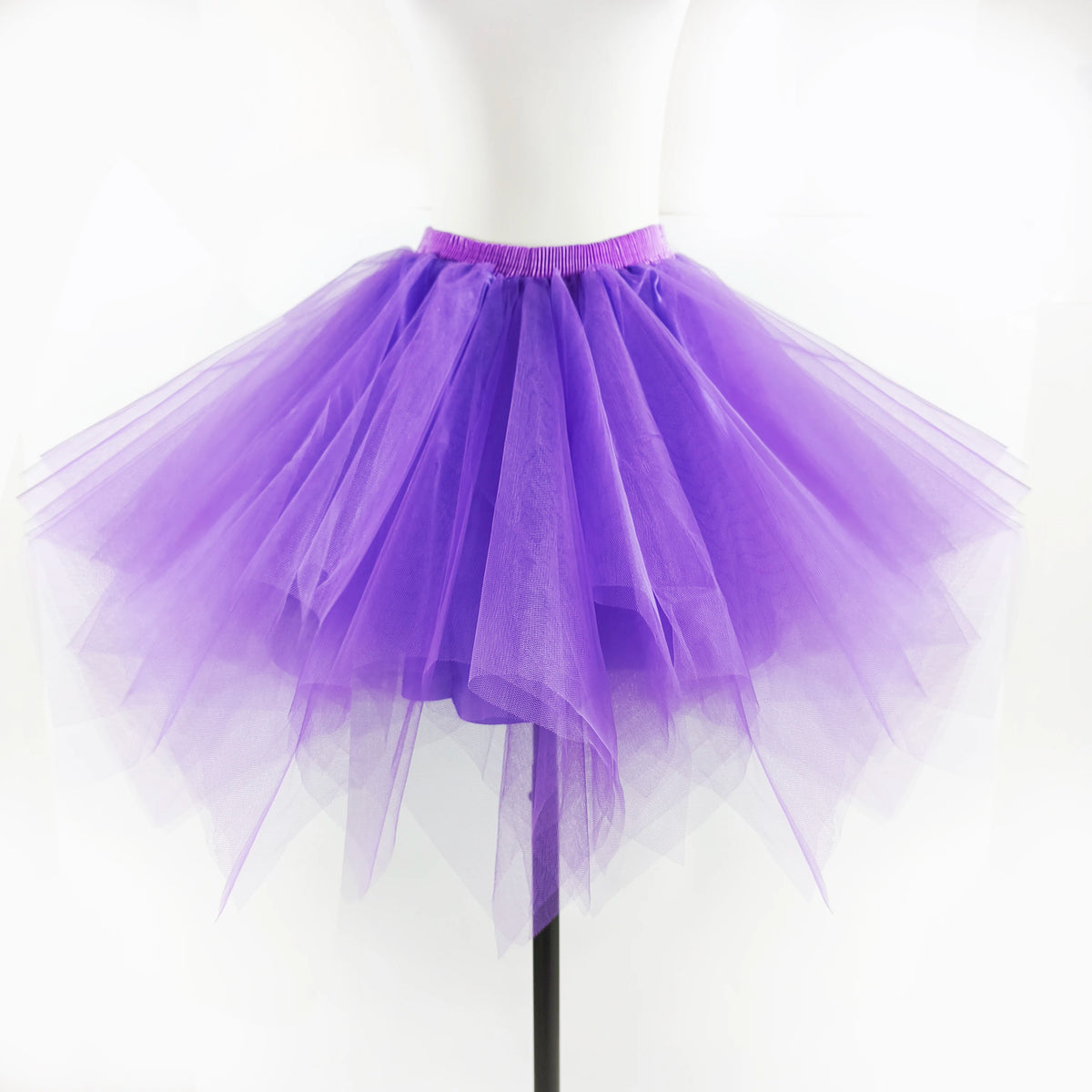Purple tulle tutu skirt displayed on a white mannequin.