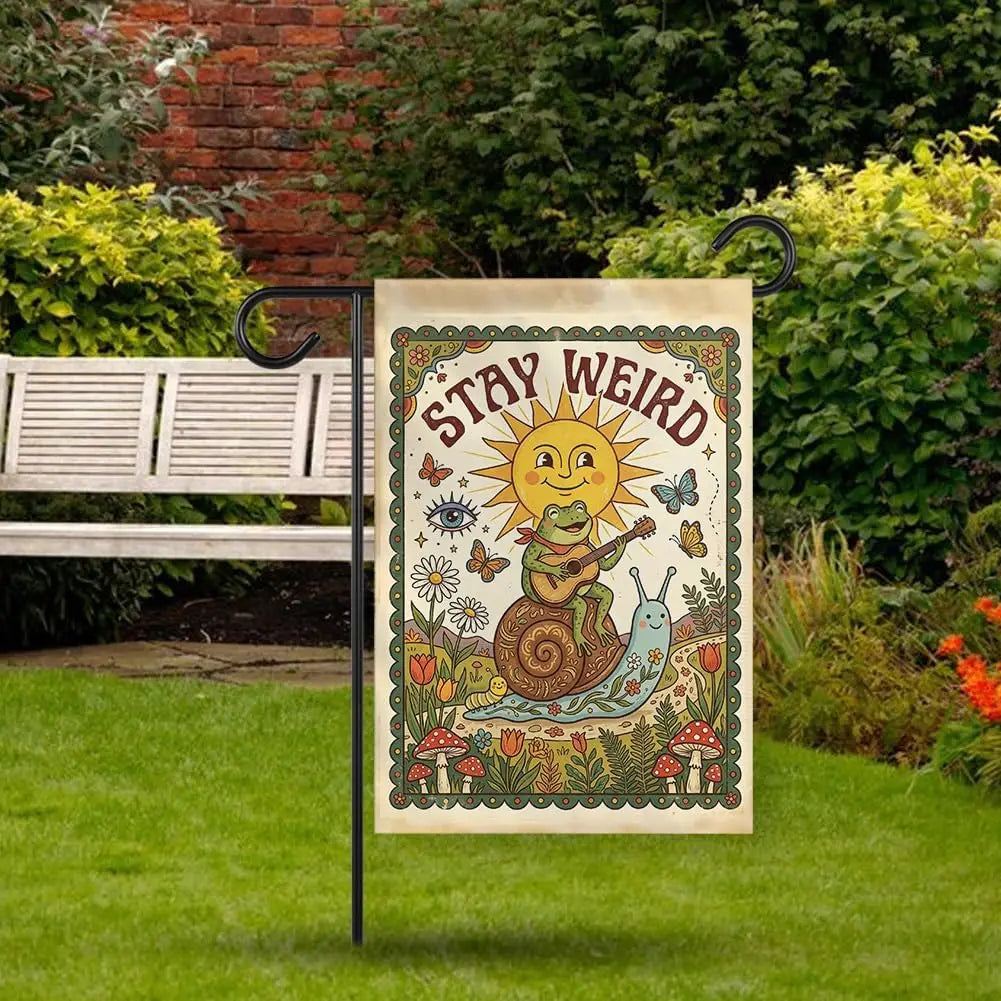 A vintage-style garden flag featuring a yellow sun and a green lizard on a floral background.