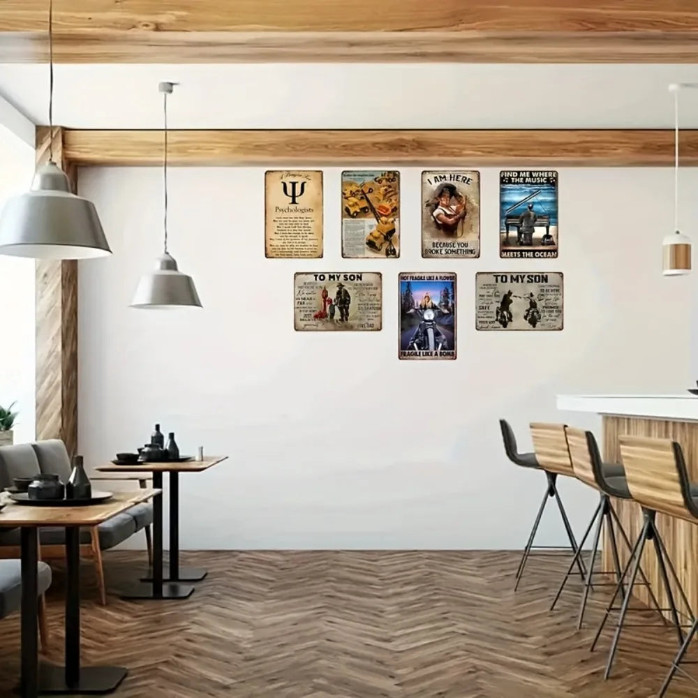 A gallery wall featuring custom aluminum signs with text and imagery mounted on a white wall.