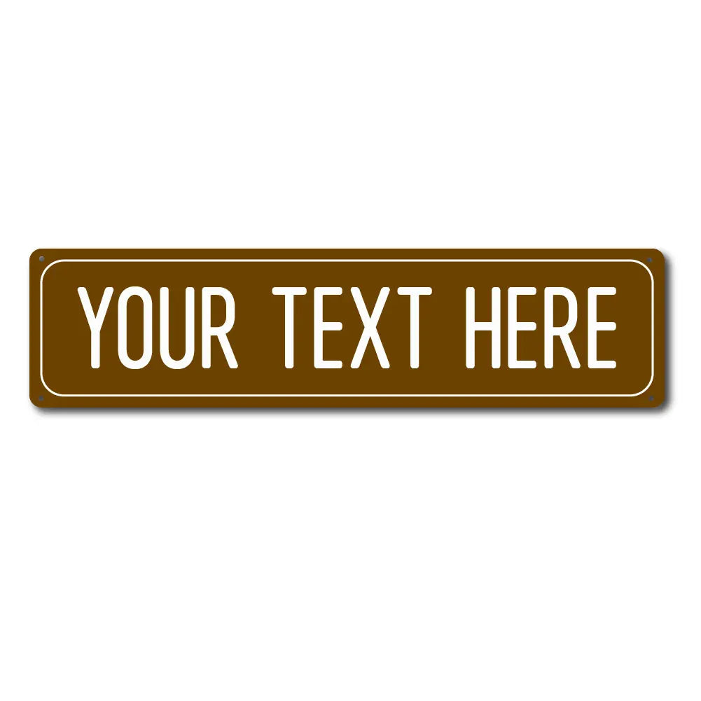 A rectangular, bronze-colored metal sign with the text YOUR TEXT HERE engraved on it.
