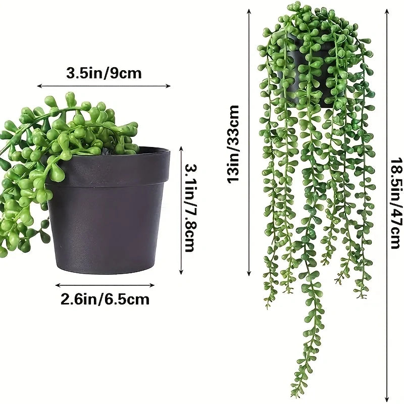 A dark gray artificial hanging plant with lush green vines, shown next to its dimensions.