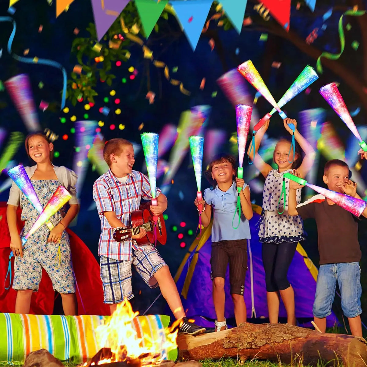 Five children holding LED fiber optic glow wands in a nighttime outdoor setting