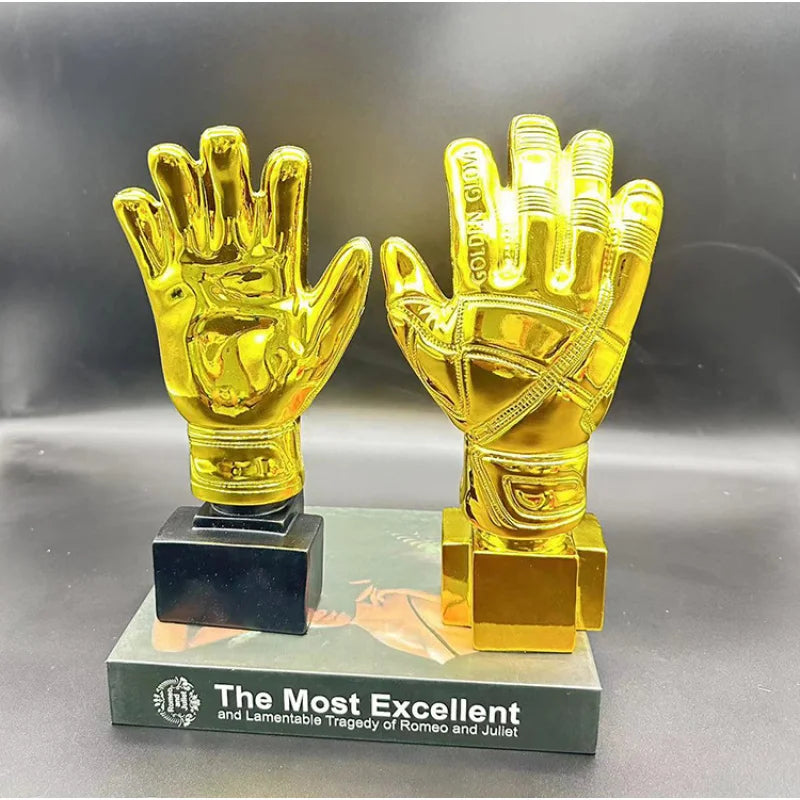 A golden glove award trophy featuring a hand design on a dark base.