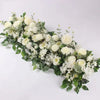 A lush arrangement of white artificial roses and greenery for event decor.
