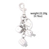 Silver golden dice keychain with a charm and a hanging loop