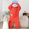 An orange coral fleece hooded sleepsuit resembling a monster with blue hair and large eyes.
