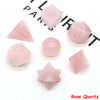 A collection of pink rose quartz crystals in various geometric shapes and sizes for healing and meditation.
