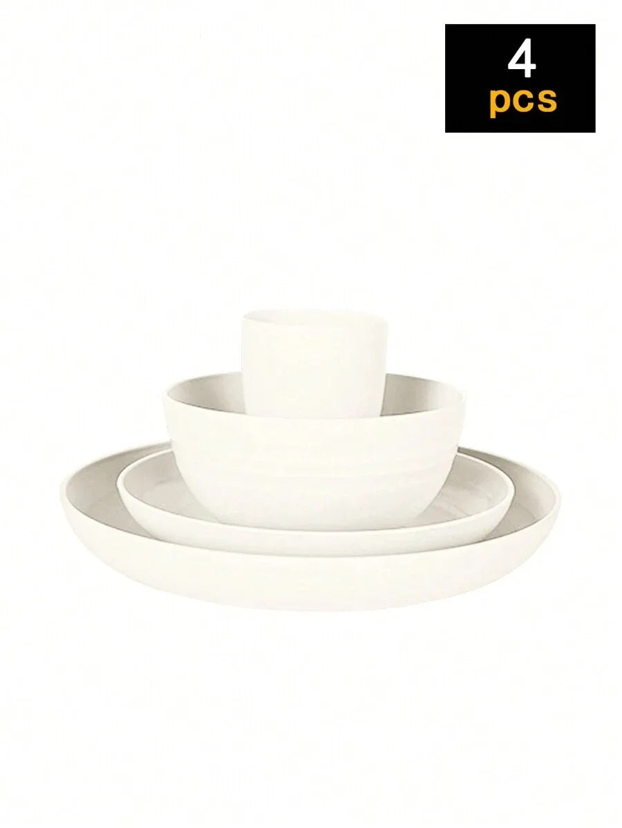 A set of four white reusable plastic tableware items including a bowl and a plate.