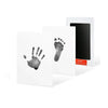 A white card featuring a dark handprint and footprint design next to a black frame.