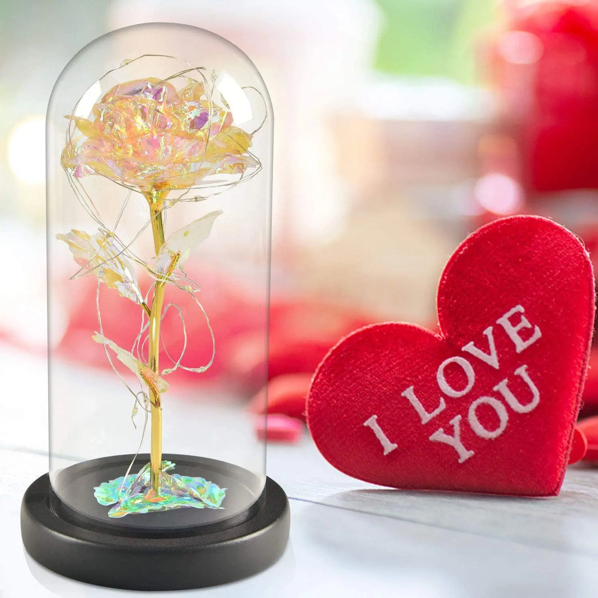 Une rose de verre éternelle avec une lumière LED sur une base noire.