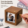 A wooden hand-crank flip photo frame is shown, demonstrating the smooth rotation mechanism.