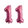 Two shiny metallic pink foil number balloons shaped like the number 1