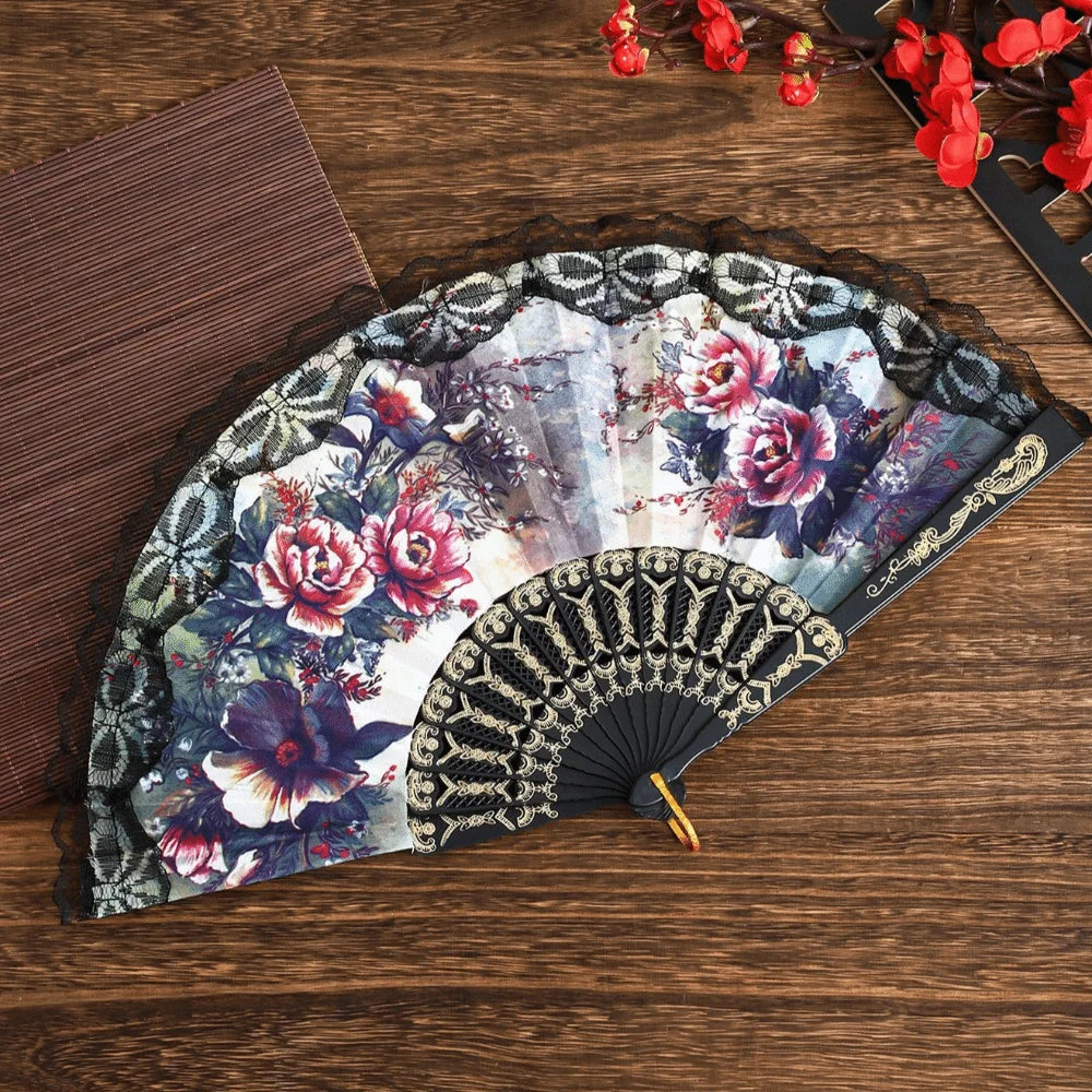 Spanish style folding lace trim handheld fan with floral patterns and black accents