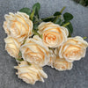 A bouquet of nine pale yellow silk roses arranged for weddings and home decor.