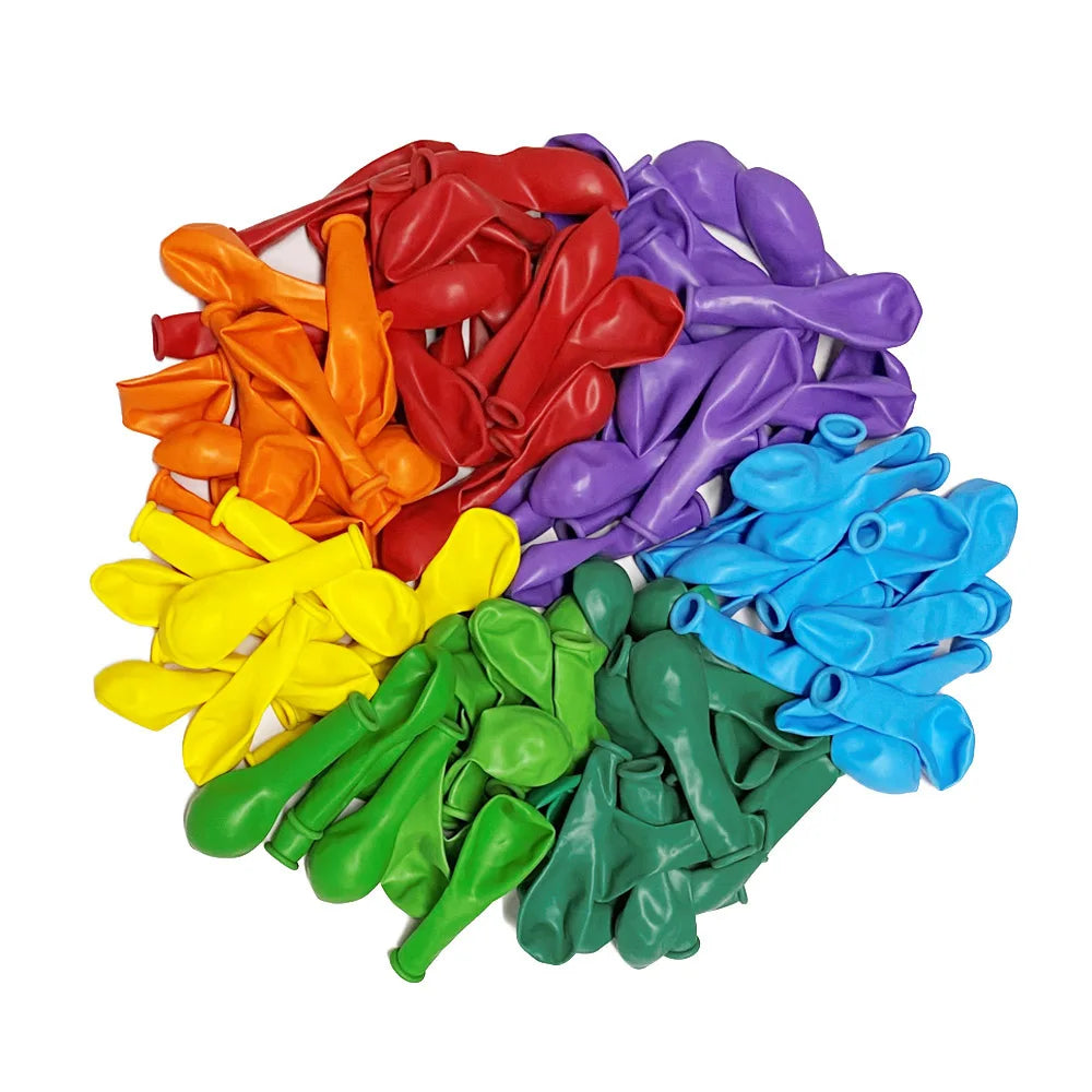 A pile of vibrant latex balloons in various colors including red, orange, yellow, purple, blue, and green.