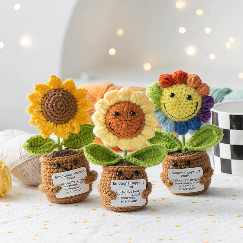 Handmade crochet sunflower desk companion with a smiling face in various colors