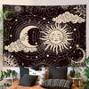A dark tapestry wall hanging featuring a celestial design with a crescent moon and sun surrounded by stars and clouds.