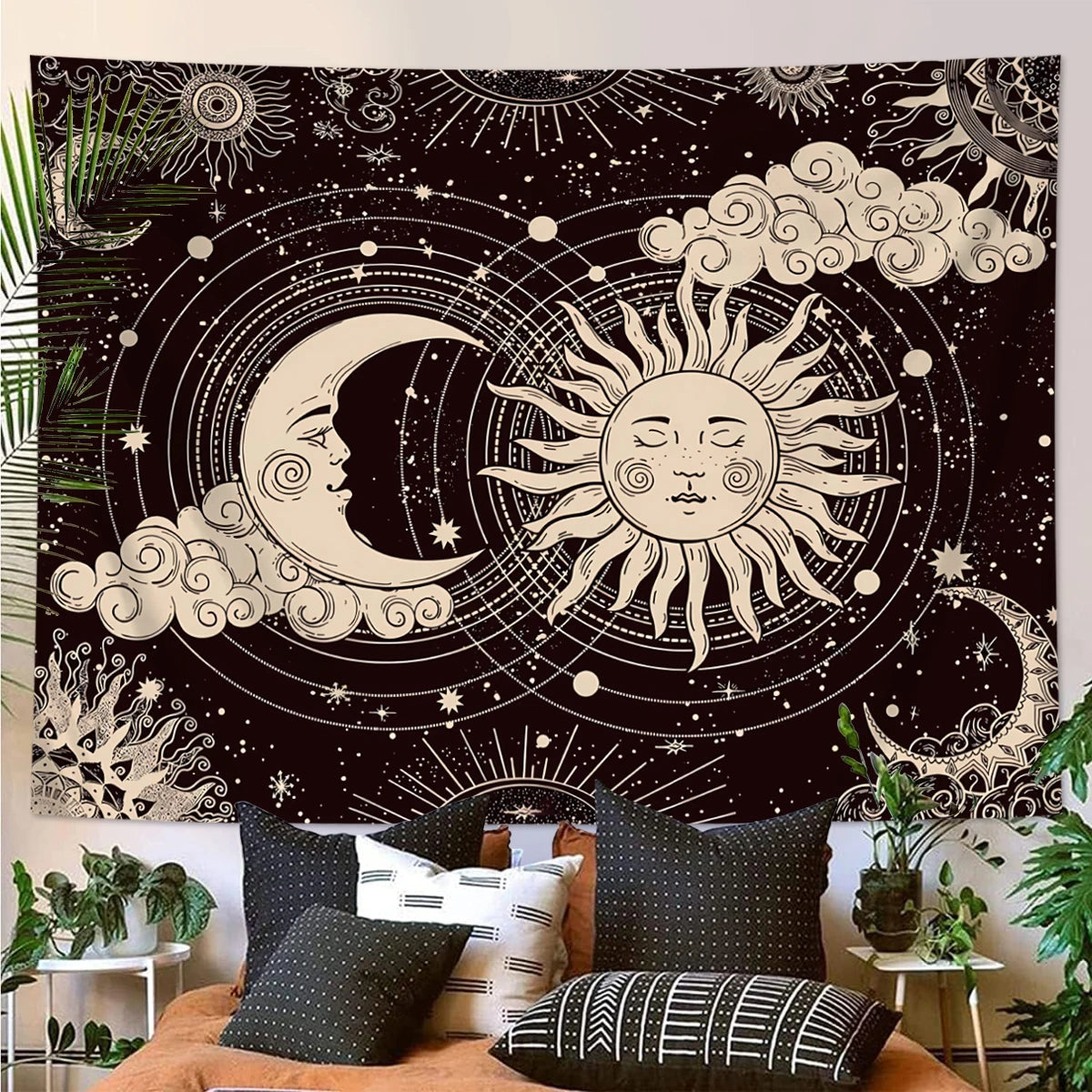 A dark tapestry wall hanging featuring a celestial design with a crescent moon and sun surrounded by stars and clouds.