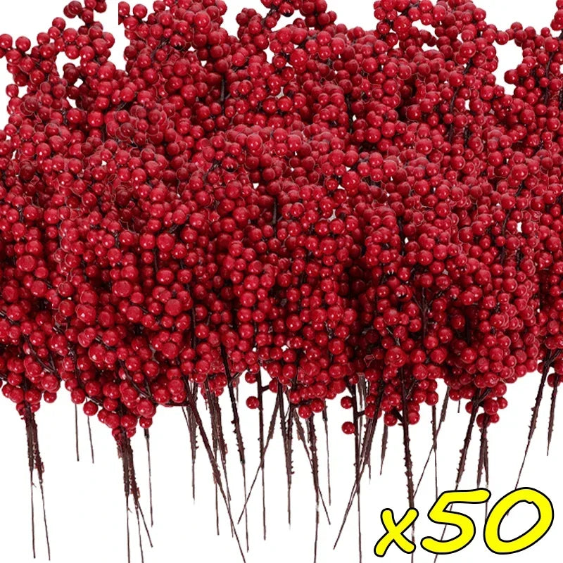 A dense cluster of artificial red holly berry stems used for Christmas decoration.