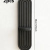 Two black wooden wall shelves with a vertical arched design, measuring 38cm long and 9cm wide.