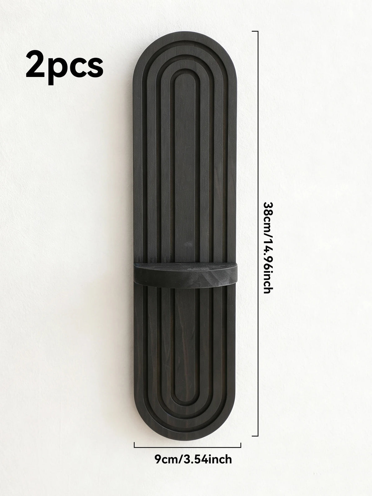 Two black wooden wall shelves with a vertical arched design, measuring 38cm long and 9cm wide.