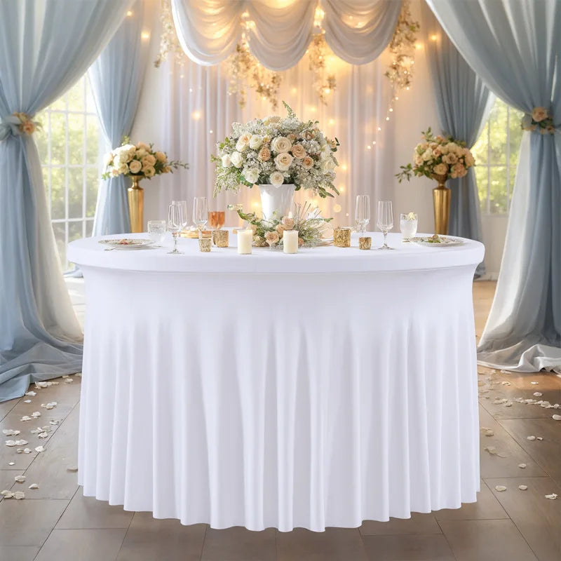A white stretch spandex round tablecloth with a pleated skirt set up for an elegant event.