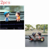 A set of two cute couple balloon car ornaments featuring a boy and a girl.