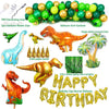 A collection of dinosaur-themed party decorations including foil balloons, a balloon arch garland, and green tinsel curtains.