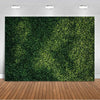 A dense, vibrant green tropical palm leaf backdrop used for party decor and photography.