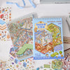 A colorful sticker book featuring miniature 3D scenes and buildings for children