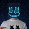 A person wearing a glowing blue neon LED party mask with a smiling face against a dark, starry background.