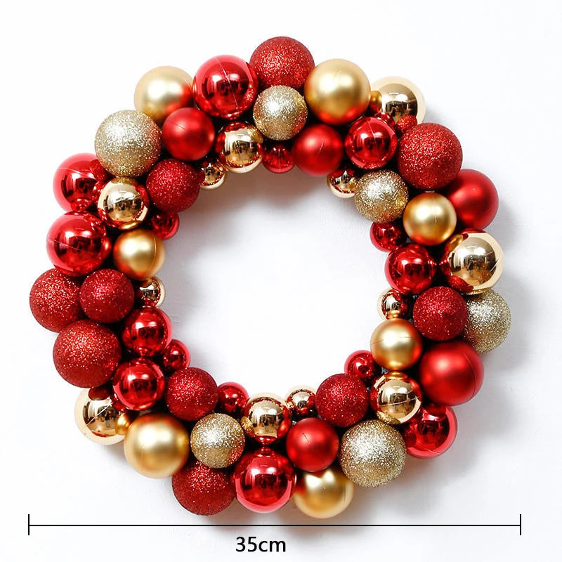 A circular wreath made of shiny red and gold Christmas ball ornaments.