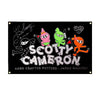 A black banner featuring cartoon characters and the text SCOTTY CAMERON with a hand-crafted putters gallery credit.