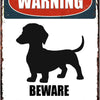 Vintage warning sign featuring a dog silhouette and text that reads WARNING BEWARE OF THE WIENER