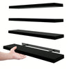 Two black floating wall shelves with invisible brackets shown in various orientations and installation context.