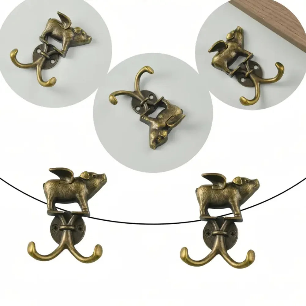 Decorative metal wall hooks shaped like animals in brass finish