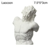 White plaster bust miniature of a male figure with curly hair