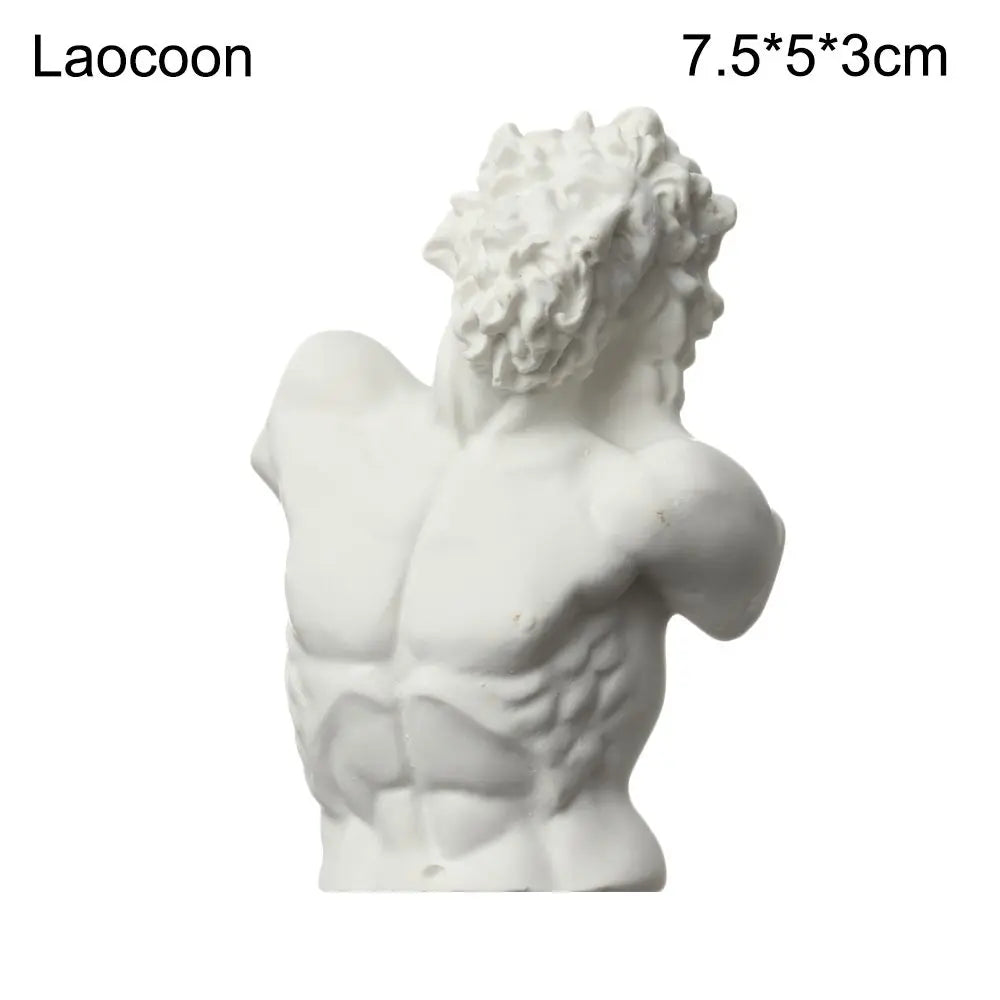 White plaster bust miniature of a male figure with curly hair