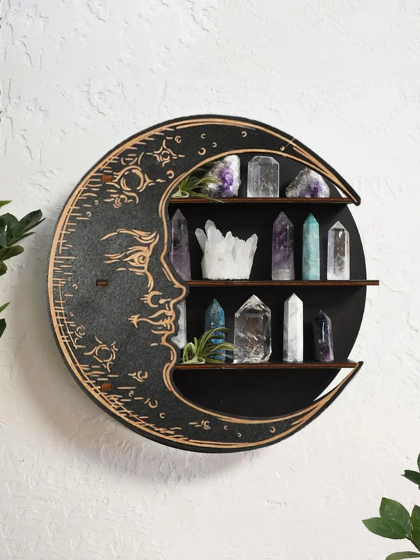A round wooden wall shelf displaying various crystals in three tiers against a dark background.