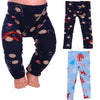 A set of Christmas themed leggings and a top for dolls, featuring patterns like snowflakes, reindeer, and festive designs.