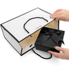 A black and white gift box with a lid is shown open, revealing a black velvet box tied with a ribbon.