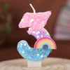 A decorative number candle shaped like a lightning bolt, featuring iridescent glitter in pink and blue hues.
