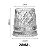 A clear crystal whiskey glass with a relief diamond pattern and a matching coaster.