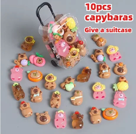 Ten plastic capybara mini figures inside a clear suitcase with soft glow effect